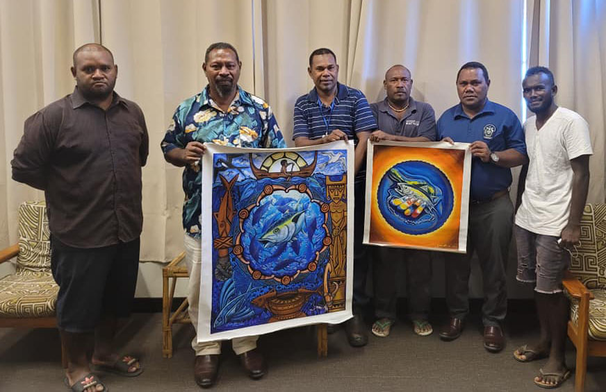 Fisheries Minister congratulates World Tuna Day Art and Talent quest winners
 

Honiara, 20 May 2022: The four winners of the Parties to Nauru Agreement (PNA) World Tuna Day Art and Talent Quest for 2022 were congratulated by the Minister of Fisheries Hon Nestor Giro at his office on Friday, 20th May 2022.

He described this year’s PNA Art and Talent Quest, as a special one for Solomon Islands, because out of the five (5) prizes that were up for grab, 4 were won by Solomon Islands Artists.

The local artists who won entered in two categories, namely music video and art

Seasoned musician and Journalism lecturer at Solomon Islands National University, Jeremy Inifiri won the music video’s first prize while Elextor Jr was the runner-up.

The others, Casper Hairiu’s entry in the Art category won him second prize while Emmanuel Manau Wainini settled for the 3rd prize also in the art category.

All entries featured the World Tuna Day 2022 theme “OUR TUNA, OUR HERITAGE.”

Minister Giro said for Solomon Islands, the theme reflects well with our societies and communities.

“Tuna has been part of our lives and history for many years. Your art work demonstrated our heritage and importance of tuna in our societies and our lives,” he added.

World Tuna day is celebrated around the globe on 2nd May every year, however, the Ministry of Fisheries and its stakeholders were unable to celebrate this year due to COVID-19 restrictions.

The Minister said Tuna is important to the economy and livelihoods of Solomon Islanders therefore, his Ministry is working closely with its partners (both regionally and internationally) to ensure tuna stocks are sustainable and healthy at all times.

The two winners in the art category formally handed over the winning art paintings to Minister Giro who received them on behalf of PNA.

“As the Minister responsible for Fisheries, I have the honour to receive your art works on behalf of all the PNA countries.

An elated Mr. Inifiri said he was delighted to have won the music video category and thanked all who contributed to make his entry successful.

“I featured my children in the music video because our tuna fishery is important for their future as well” he said.

Meanwhile, Hon Giro has encouraged the winners to continue to show their talent in future PNA World Tuna Day Art and Talent quest.

“This is your opportunity to share and show your love for tuna and the importance of tuna to our country through your art work and music”, he said.  Ends//