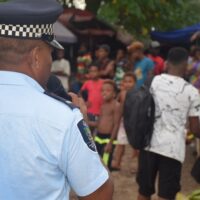 RSIPF officer talk to the people at in Honiara market on PM election