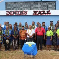 MEHRD delegation, DFAT rep, Malaita Education Office, Police rep and other guests in front of the newly built school dinning hall.