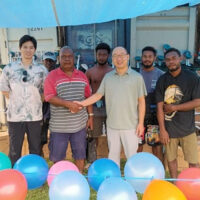 A formal handover of the agricultural tools from PRC to Central Makira Constituency. Pictured, Constituency Development Officer (CDO) Gravis Tahiri receiving the assistance from the Chinese Embassy in Solomon Islands, Head of Political Section Gu Wenlong in the presence of constituency and PRC Embassy representatives.
