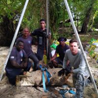 325lb bomb Tripod Crew pose for a photo before continue on with the high risk task in Taro- Choiseul Province 325lb bomb Tripod Crew pose for a photo before continue on with the high risk task in Taro- Choiseul Province