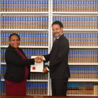 Charge de Affairs of the Permanent Mission of Solomon Islands Charge de Affairs of the Permanent Mission of Solomon Islands, Ms. Fiona Indu hands over its Instrument of Accession to the United Nations Convention against Transnational Organized Crime (UNTOC) to the Chief of the Treaty Division of the United Nations, Mr David Nanopoulos at United Nations headquarters in New York.