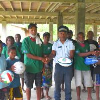 Sporting equipment is handed over to chiefs from Kubolota Village. Sporting equipment is handed over to chiefs from Kubolota Village.