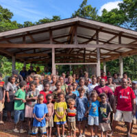 Photo 1 Members of the Waiasi Piggery Farmers Association in Waipina Village in South Malaita at their new piggery house supported by the SIART Project. Women and children also participated during the training delivered at their village last week.