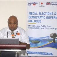 Picture1 SIEC Chief Electoral Officer & Commissioner Jasper Highwood Anisi delivers the keynote address at the Media, Elections and Democratic Governance Dialogue, emphasizing the importance of accurate election information and strong media partnerships.