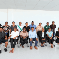 Interns with the Permanent Secretary (centre) and Heads of Divisions of the Ministry of Lands,
Housing & Survey.