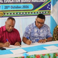 Picture_5 Hon. Minister of Education Stephen Kumi and Rennell and Bellona Premier, Hon. Erick T. Saueha, sign the Agency Agreement at Honiara Hotel as Provincial Secretary Selwyn Vasuni looks on.