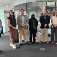 Standing at the centre is the MPNSCS Director for National UXO, Benzily Kasutaba, alongside GICHD staff. Standing at the centre is the MPNSCS Director for National UXO, Benzily Kasutaba, alongside GICHD staff.